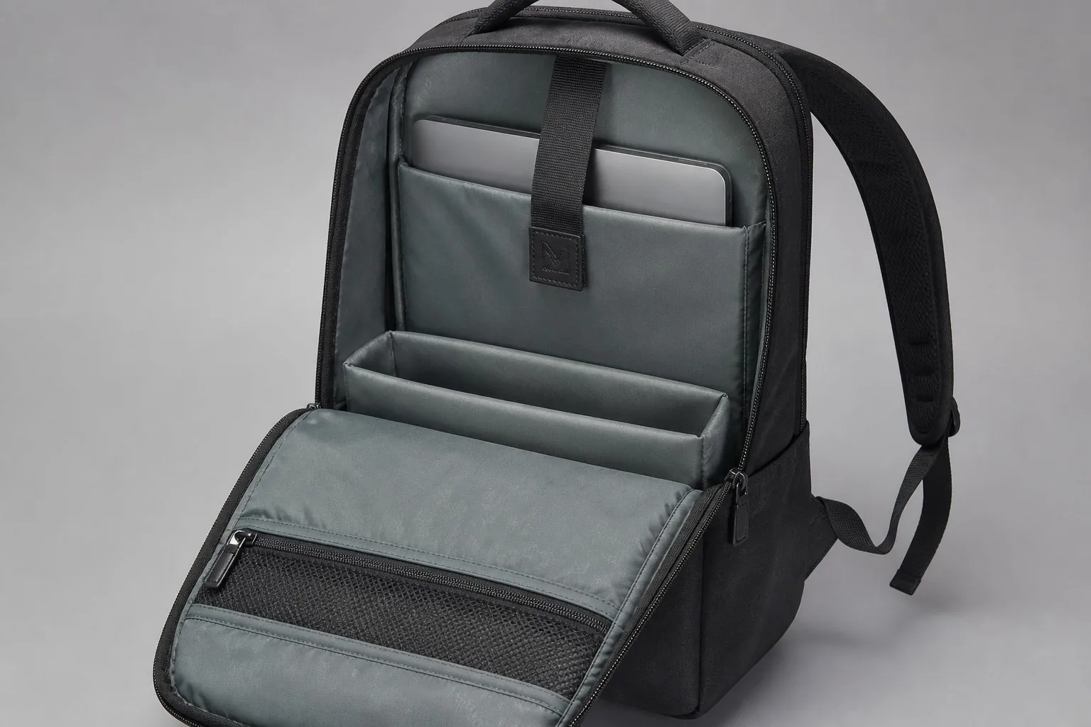 Open backpack showing laptop compartment with padded suspension sleeve