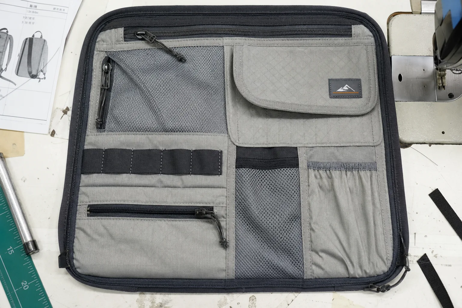 Backpack front organizer panel showing multiple pocket constructions