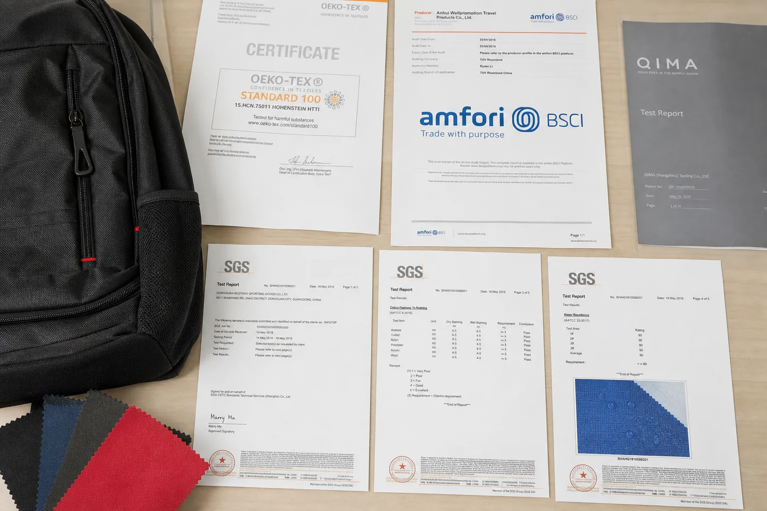 Compliance test reports and certificates beside material swatches