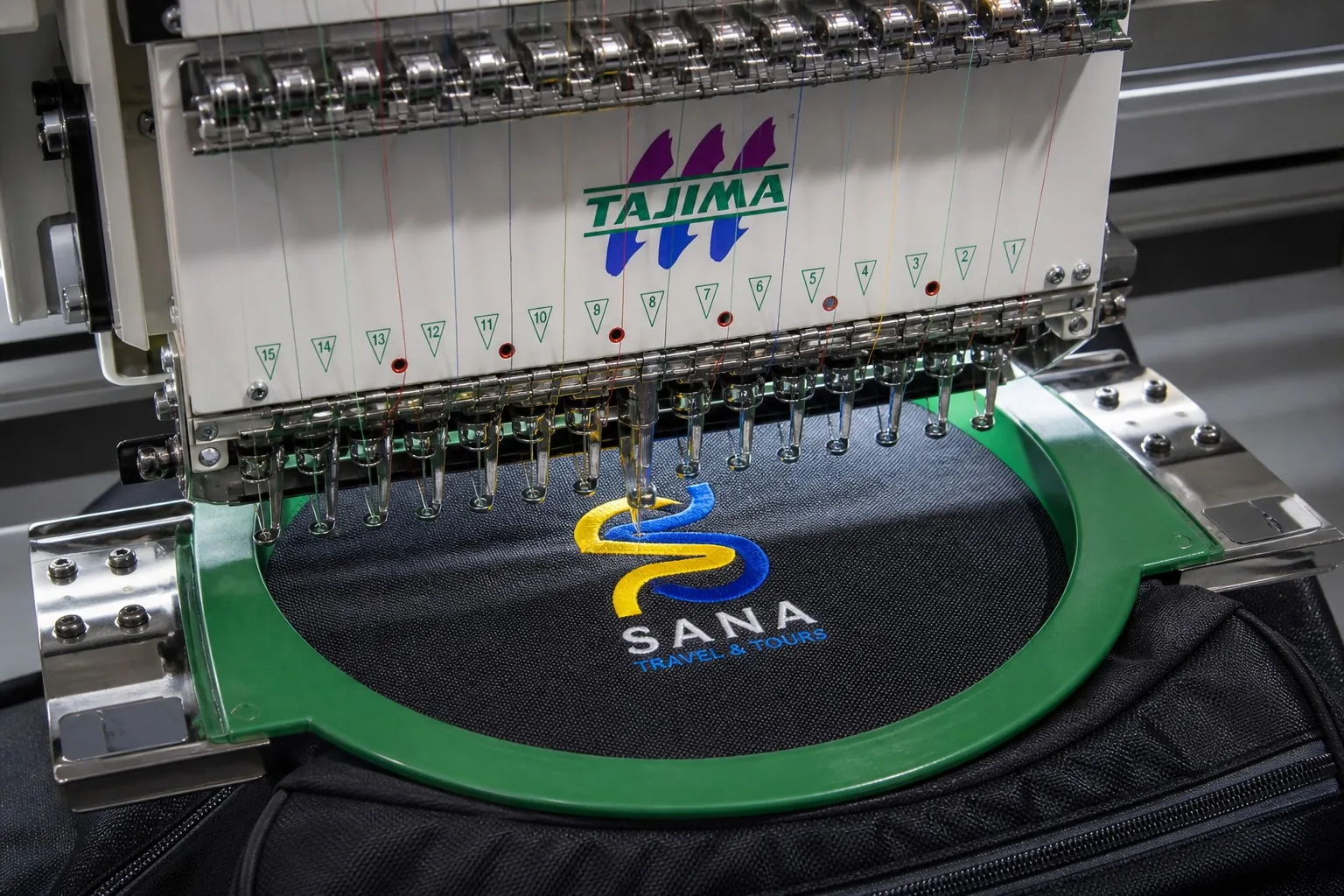 Computerized embroidery machine stitching logo