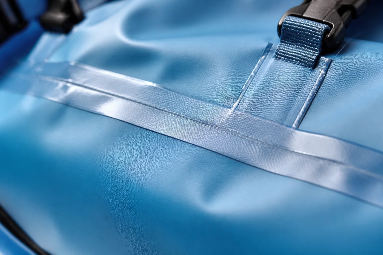 Seam sealing tape applied along a waterproof backpack seam