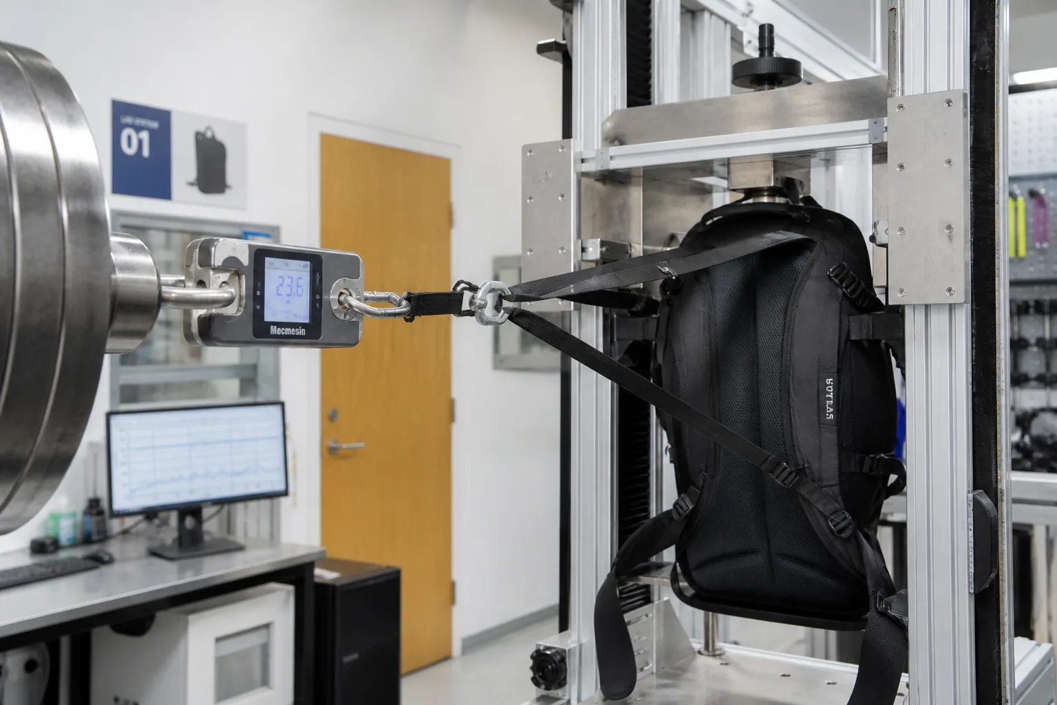 Load testing a backpack harness in the factory lab